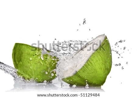 Green coconut with water splash isolated on white