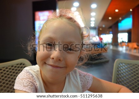 Happy beautiful little girl portrait outdoors                               