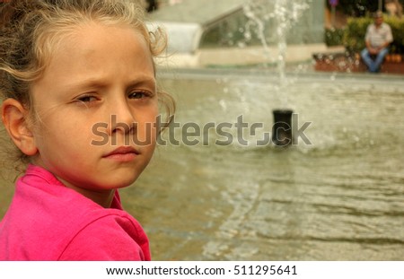 Happy beautiful little girl portrait outdoors                               