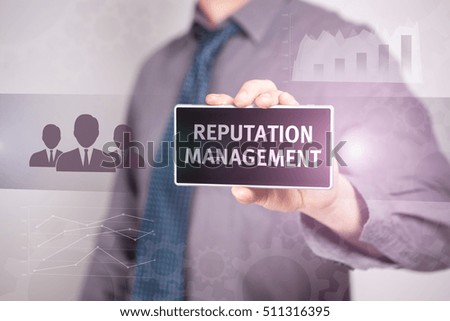 Close-Up Businessman Holding A Smartphone With The Text "Reputation Management" Business concept. Internet concept.