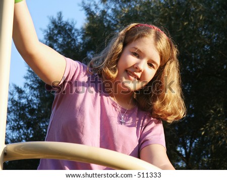 Girl on playground equipment