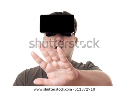 man wearing VR virtual reality headset reaching out with his hand
