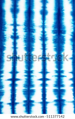 striped tie dye pattern on cotton fabric abstract background.
