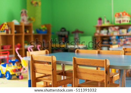Chairs, table and toys. Interior of kindergarten. Royalty-Free Stock Photo #511391032