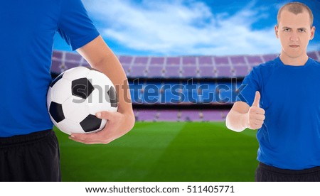 two soccer players with ball on field of big stadium