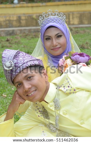 Malay couple bride wearing traditional style wedding dress ( soft focus at full resolution )