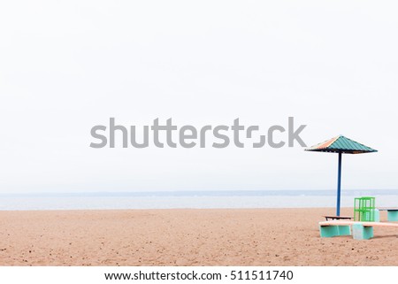 deserted beach lonely sun umbrella on the sand