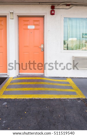 room entrance with ramp for disabled person and wheelchair