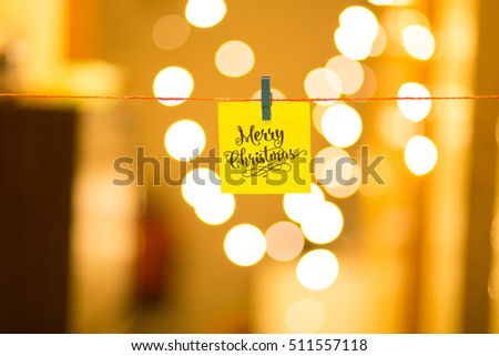 Merry Christmas and Happy New Year on bokeh background, festive defocused lights.
 Royalty-Free Stock Photo #511557118