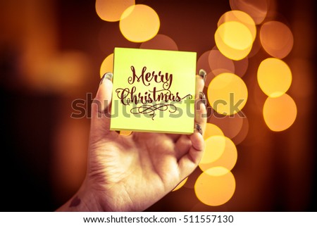 Merry Christmas and Happy New Year on bokeh background, festive defocused lights.
 Royalty-Free Stock Photo #511557130