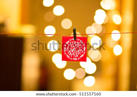 Merry Christmas and Happy New Year on bokeh background, festive defocused lights.
 Royalty-Free Stock Photo #511557160