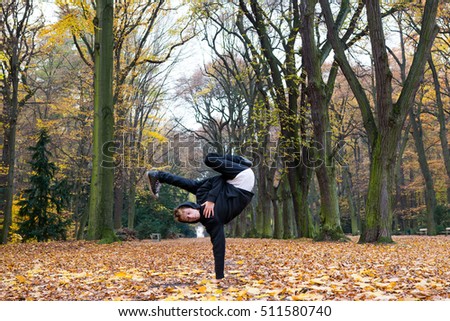 Breakdancer on the autumn park