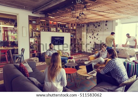 young people group in modern office have team meeting and brainstorming while working on laptop and drinking coffee Royalty-Free Stock Photo #511583062