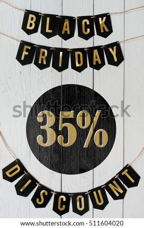 Black Friday thirty five percent Discount paper banner garland lettering hanging on white barn wood planks background. Beautiful vertical holiday flyer.