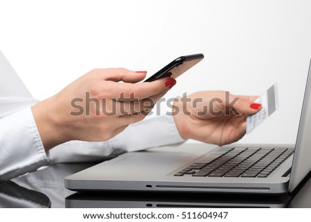 
Online payment,Woman's hands holding a credit card and using smart phone for online shopping