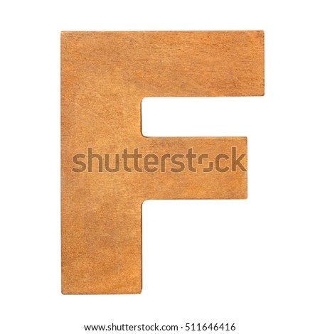 Old wooden letter F on wooden background. One of full alphabet wooden set
