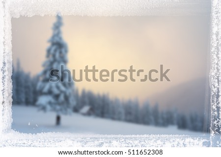 Christmas background for design. Blurred picture of the nature and frame of frost.