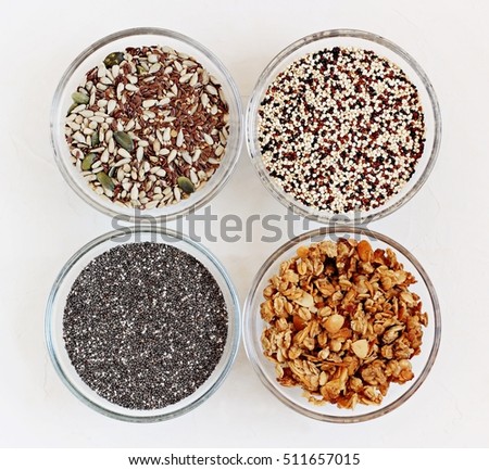 Quinoa,chia seeds,seed mix and granola.The base products in super foods and clean eating concept.