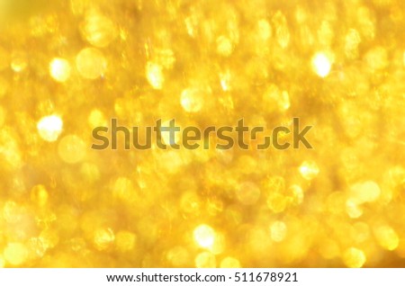 Gold Glitter Speckles Floating in Water
