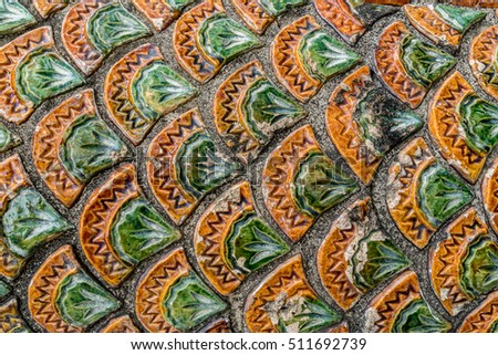 Thai ancient dragon's scaly stucco in temple