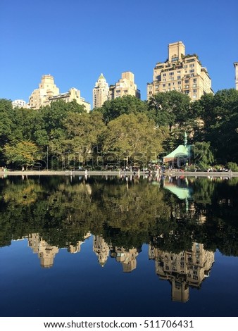 The Bulidings reflect on the lake in central park ,New york