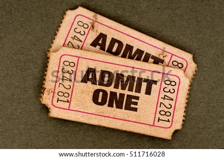 Pair of old torn admit one tickets  Royalty-Free Stock Photo #511716028