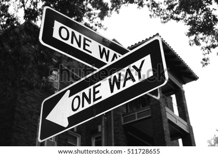 Opposite facing one way signs.