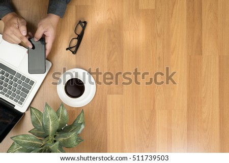 Hipster wooden desktop with laptop, office accessories, flat lay top view