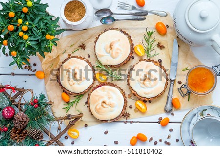 Small Pastry Tartlets Filled with Vanilla Cream, Lemon Curd and Fresh Berries on Rustic White Wooden Table, Christmas English Tea Ceremony, Top View