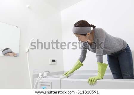 Women carefully cleaning the bathroom