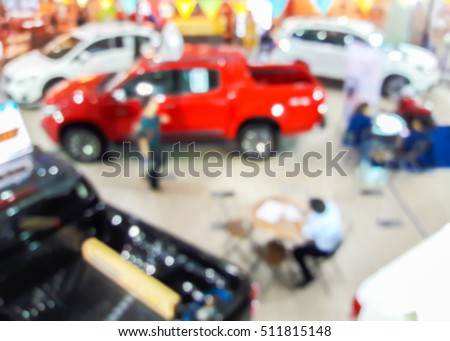 Blur image of car showroom in the mall, use for background.