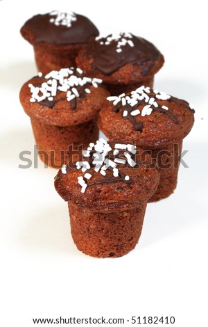 chocolate muffins isolated on white
