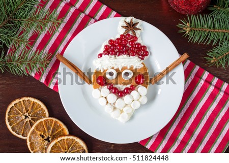 Santa pancake! Funny Christmas breakfast for kids. Creative idea for children breakfast food. Christmas food, Christmas food background, kids food on a plate