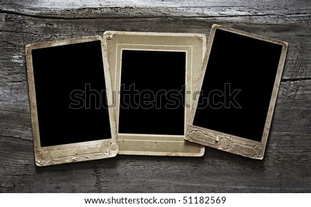 Antique photo frame on wooden background