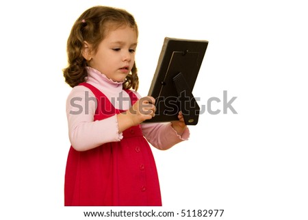 Young girl isolated on white looking at picture frame with sad facial expression