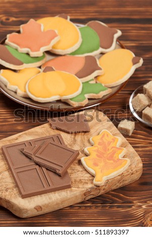 Autumn Style. Homebaked Decorated Sugar Cookies With Royal Icing. Olive Tree Wooden Board. Chocolate