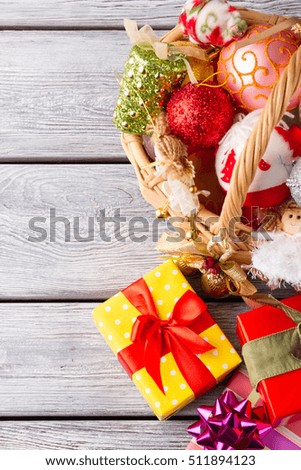 Christmas gifts for friends and relatives. Basket with Christmas decorations.