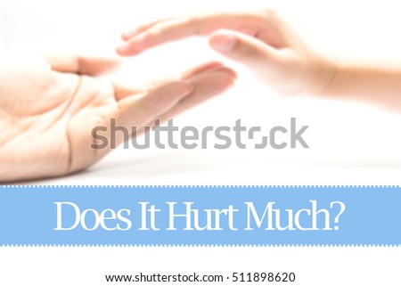 Does It Hurt Much? - Heart shape to represent medical care as concept. The word Does It Hurt Much? is a part of medical vocabulary in stock photo.