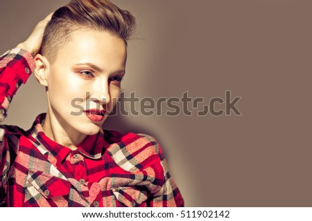 Portrait of young attractive woman with short hair. toned vintage dark image Royalty-Free Stock Photo #511902142