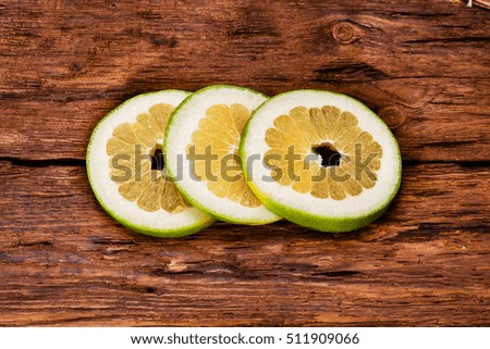 Citrus fruits on wood table background with copy space