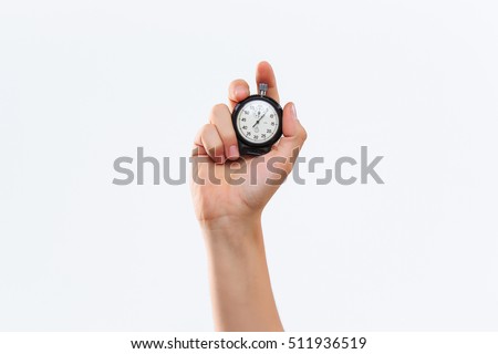 The male hand holding a stopwatch against a white background Royalty-Free Stock Photo #511936519