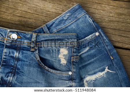 blue denim jean texture on wood background

