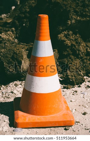 warning traffic cone close up, tinted photo
