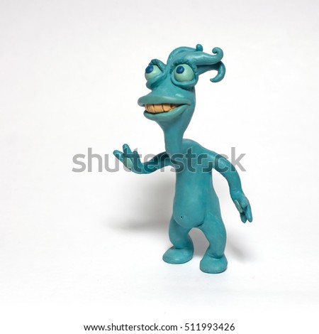 
Cobbled together from plasticine funny original monsters. Isolated character on white background Royalty-Free Stock Photo #511993426