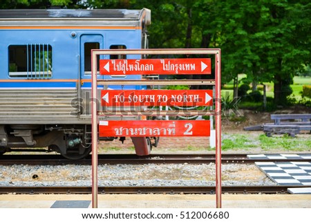 Signpost to south and north and to Su-ngai Kolok and Bangkok with Thai word on platform number two in Hua Hin Railway Station, Thailand