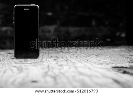 black phone wooden background