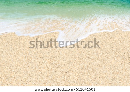 wave of green sea on sandy beach. Green ocean and sand texture. Background. sunny
