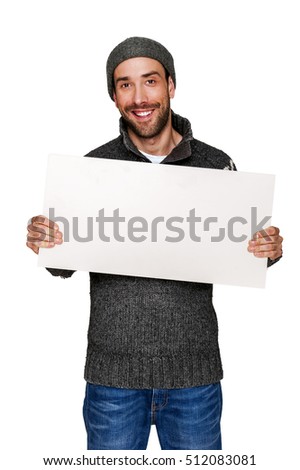 man with white board in warm clothing, copy space.