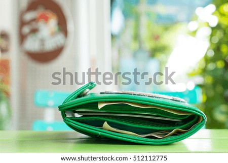 Green Wallet on Green Table