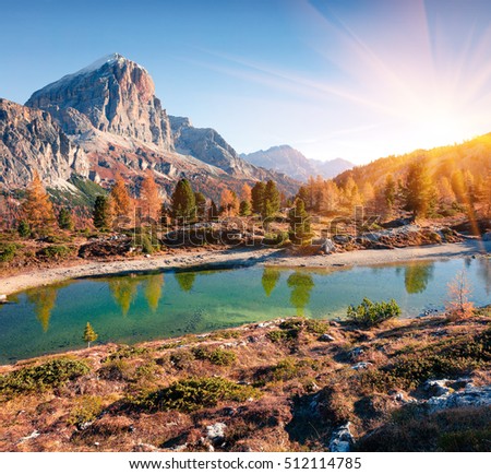Splendid view of Limides Lake and Lagazuoi mountain. Colorful autumn morning in Dolomite Alps, Falzarego pass, Cortina d'Ampezzo lacation, Italy, Europe. Artistic style post processed photo.